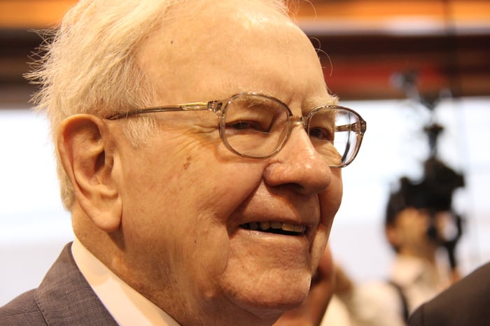 A close-up of Warren Buffett smiling.